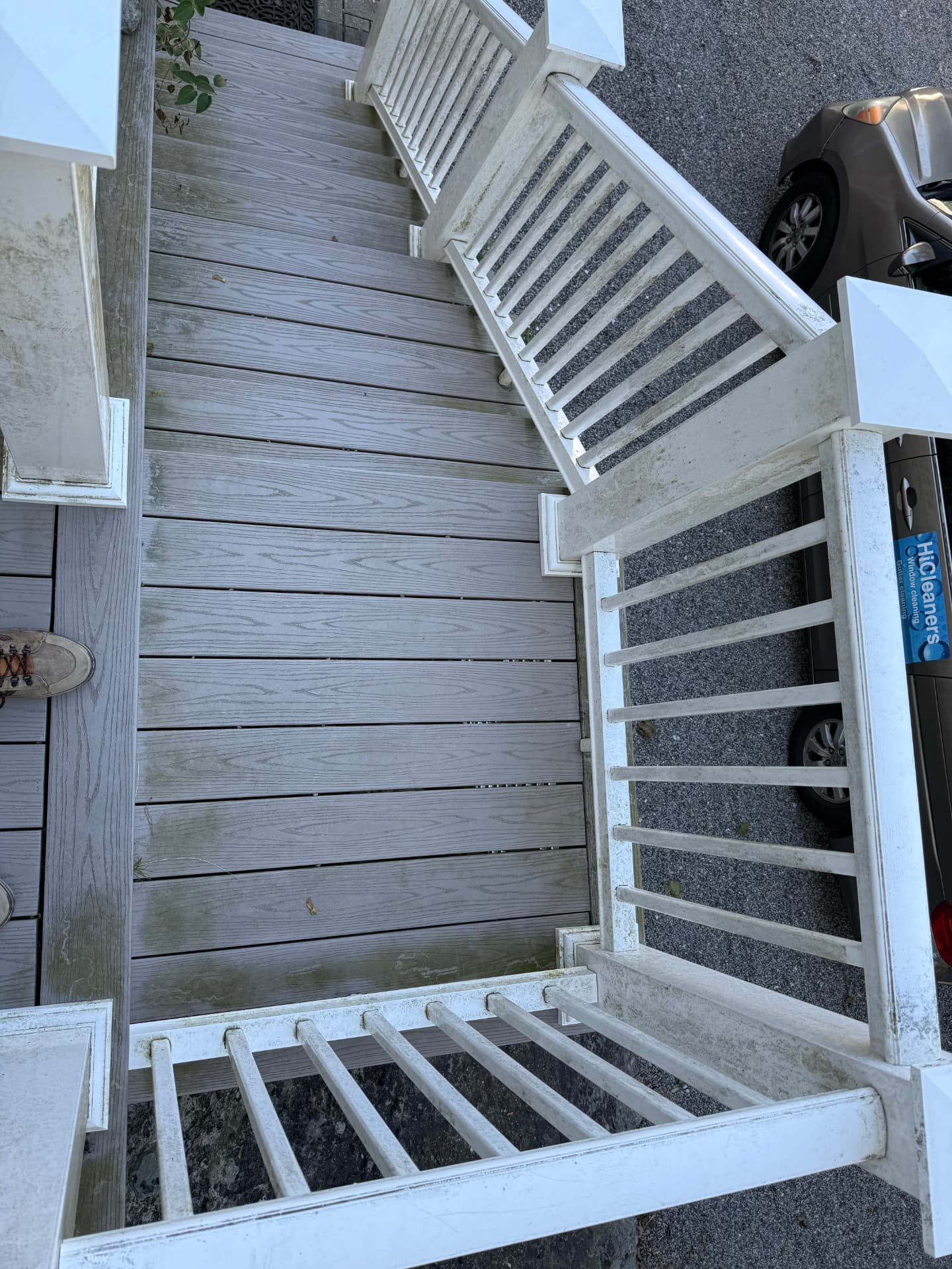 Composite deck floor and rails dull and dirty before washing