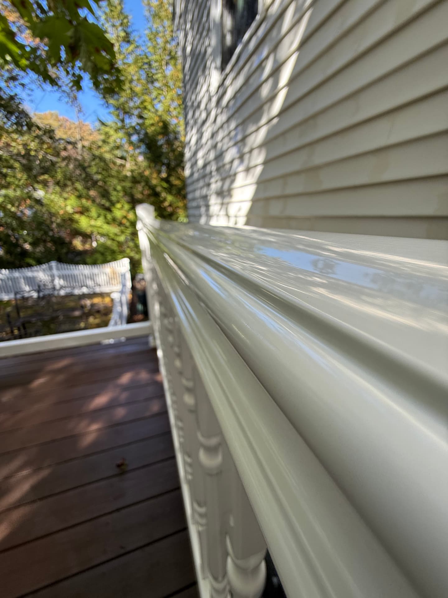 Deck railing washed back to a clean white finish